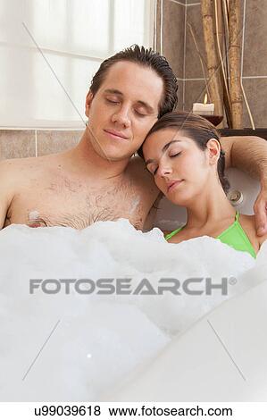 Stock Photo - Couple resting in the bathtub. Fotosearch