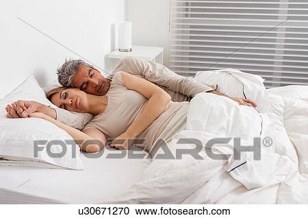 Stock Image - Couple sleeping. Fotosearch