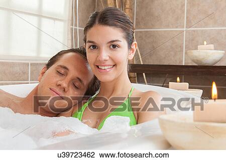 Couple taking a bath View Large Photo Image Stock Image - Couple taking a bath. Fotosearch