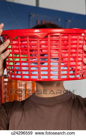 Covers his face with basket View Large Photo Image Stock Photo - Covers his face with basket. Fotosearch