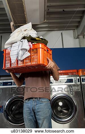 Covers his face with basket View Large Photo Image Stock Photo - Covers his face with basket. Fotosearch