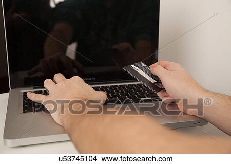 Picture - Credit card and computer. Fotosearch