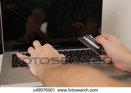 Stock Image - Credit card and computer. Fotosearch