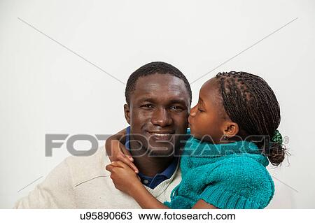 Daughter kissing her father View Large Photo Image Stock Image - Daughter kissing her father. Fotosearch