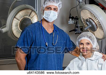 Stock Photograph - Doctor and patient looking at camera. Fotosearch