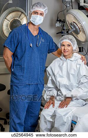 Stock Photography - Doctor and patient looking at camera. Fotosearch