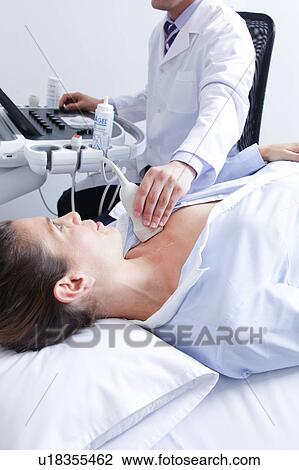 Doctor doing a doppler sonography View Large Photo Image Stock Image - Doctor doing a doppler sonography. Fotosearch