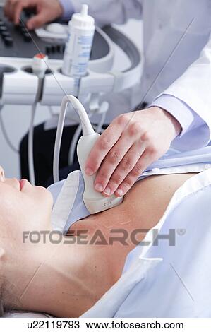Doctor doing a doppler sonography View Large Photo Image Stock Image - Doctor doing a doppler sonography. Fotosearch