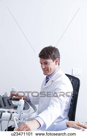 Doctor doing a doppler sonography View Large Photo Image Stock Image - Doctor doing a doppler sonography. Fotosearch