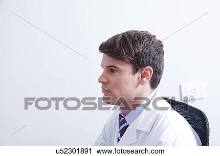Stock Image - Doctor doing a doppler sonography. Fotosearch