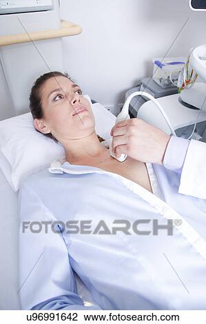 Doctor doing a doppler sonography View Large Photo Image Stock Image - Doctor doing a doppler sonography. Fotosearch