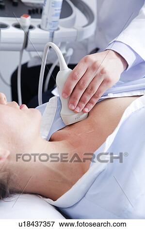 Stock Photo - Doctor doing a doppler sonography. Fotosearch