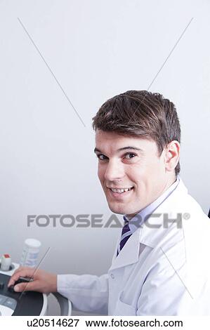 Stock Photo - Doctor doing a doppler sonography. Fotosearch