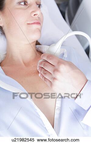 Stock Photography - Doctor doing a doppler sonography. Fotosearch