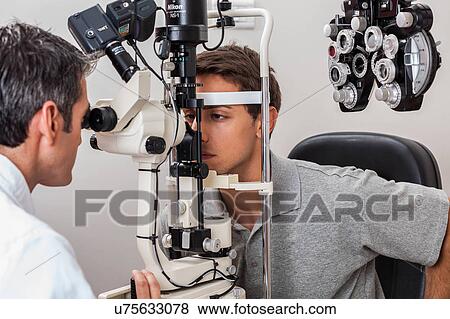 Stock Photo - Doctor examining patient. Fotosearch