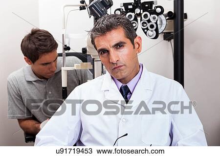 Doctor looking at camera View Large Photo Image Stock Image - Doctor looking at camera. Fotosearch