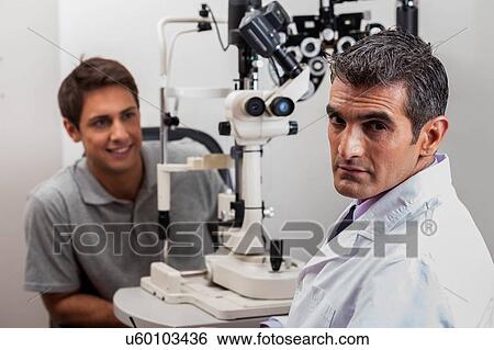 Stock Photograph - Doctor looking at camera. Fotosearch