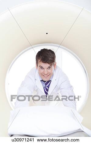 Stock Image - Doctor made a tomography. Fotosearch