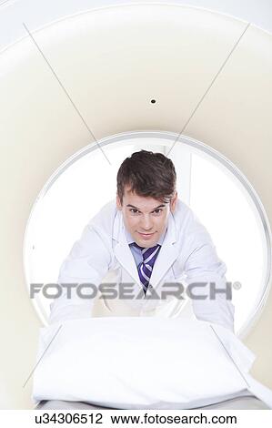Stock Image - Doctor made a tomography. Fotosearch