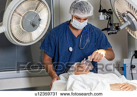 Doctor putting anesthesia View Large Photo Image Stock Image - Doctor putting anesthesia. Fotosearch