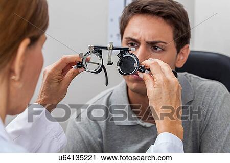 Doctor showing special lenses View Large Photo Image Stock Image - Doctor showing special lenses. Fotosearch