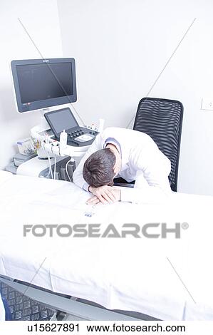 Stock Image - doctor sleeping. Fotosearch