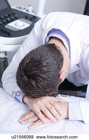 Stock Photo - doctor sleeping. Fotosearch