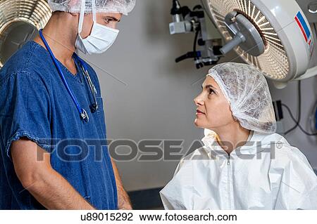 Stock Image - Doctor talking with the patient. Fotosearch