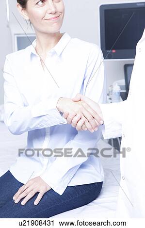 Stock Image - Doctor with a patient. Fotosearch