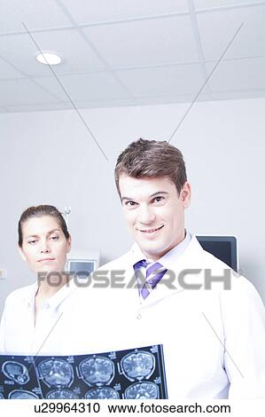 Stock Image - Doctor with a patient. Fotosearch