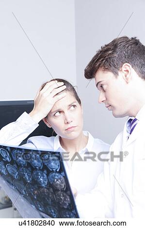 Stock Image - Doctor with a patient. Fotosearch