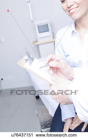Stock Image - Doctor with a patient. Fotosearch
