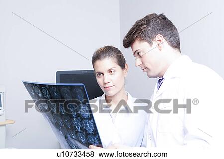 Doctor with a patient View Large Photo Image Stock Photo - Doctor with a patient. Fotosearch