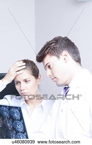 Stock Photo - Doctor with a patient. Fotosearch