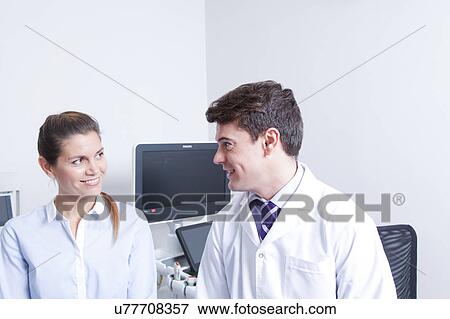 Stock Photo - Doctor with a patient. Fotosearch