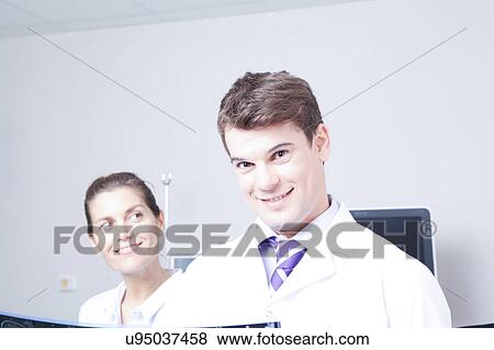 Doctor with a patient View Large Photo Image Stock Photo - Doctor with a patient. Fotosearch