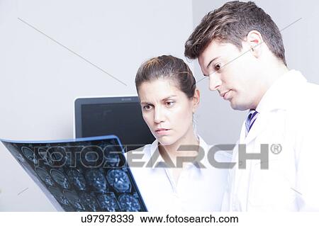 Stock Photo - Doctor with a patient. Fotosearch