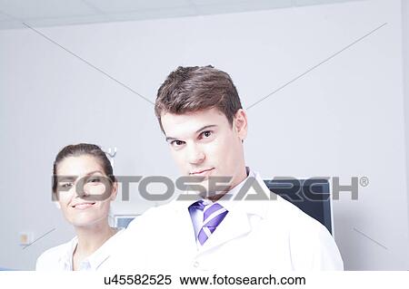 Stock Photography - Doctor with a patient. Fotosearch