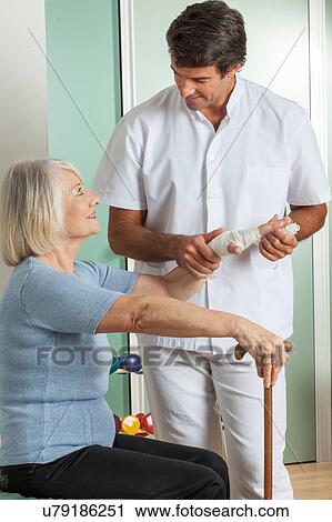 elder woman and his doctor View Large Photo Image Stock Image - elder woman and his doctor . Fotosearch