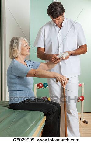 elder woman and his doctor View Large Photo Image Stock Photo - elder woman and his doctor . Fotosearch