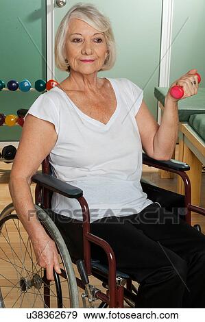 Stock Photo - Elder woman in a wheelchair. Fotosearch
