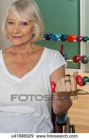 Stock Photo - Elder woman in a wheelchair. Fotosearch