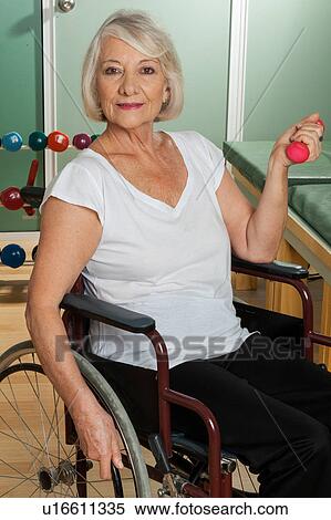 Stock Photography - Elder woman in a wheelchair. Fotosearch