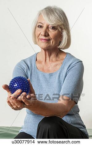 Elderly Woman who rehabilitates his hand View Large Photo Image Picture - Elderly Woman who rehabilitates his hand. Fotosearch