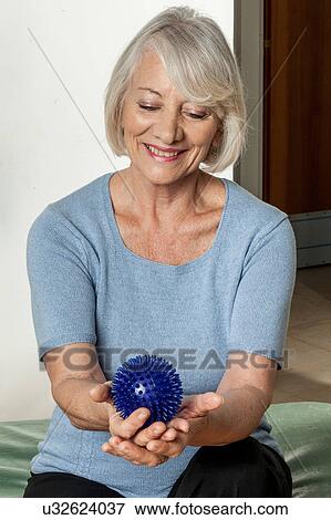 Elderly Woman who rehabilitates his hand View Large Photo Image Stock Photo - Elderly Woman who rehabilitates his hand. Fotosearch