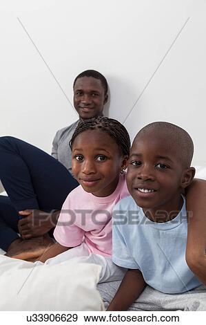 Family in the bed View Large Photo Image Stock Photo - Family in the bed. Fotosearch