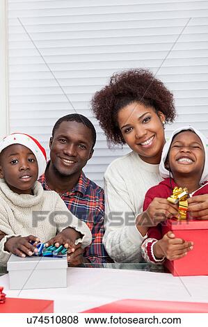 Family together assembling gift View Large Photo Image Stock Photo - Family together assembling gift. Fotosearch