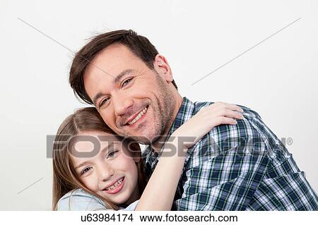 Father and daughter giving himself a hug View Large Photo Image Picture - Father and daughter giving himself a hug. Fotosearch