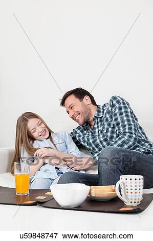 Stock Photo - Father and daughter giving himself a hug. Fotosearch