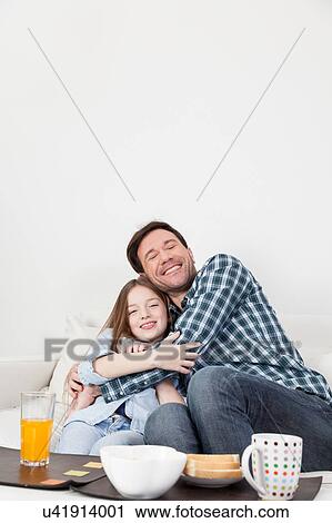 Father tickling to his daughter View Large Photo Image Stock Image - Father tickling to his daughter. Fotosearch